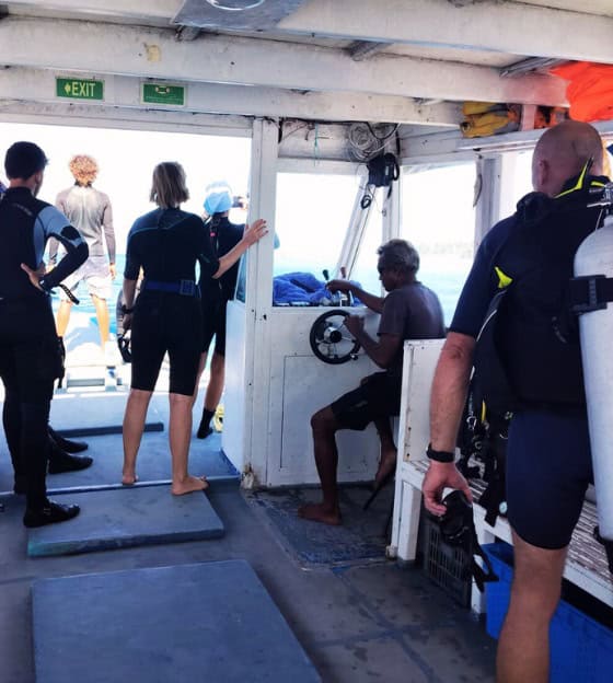 Divers on a boat trip in Rasdhoo Atoll, Maldives